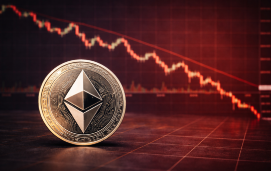 An Ethereum coin placed in front of a red downward cryptocurrency price chart showing a market decline.
